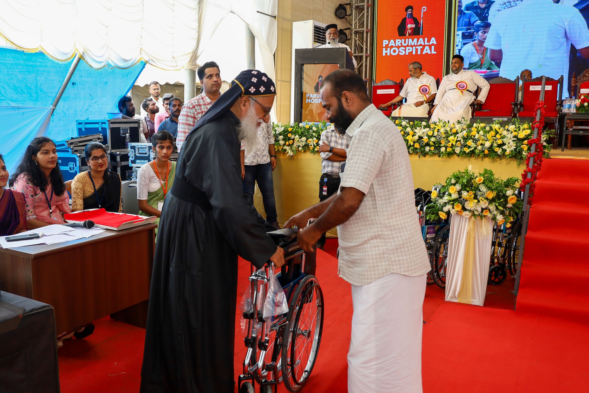 Parumala Hospital Donates 50 Wheelchairs to Government Hospitals and Palliative Care Centers During Golden Jubilee Celebration